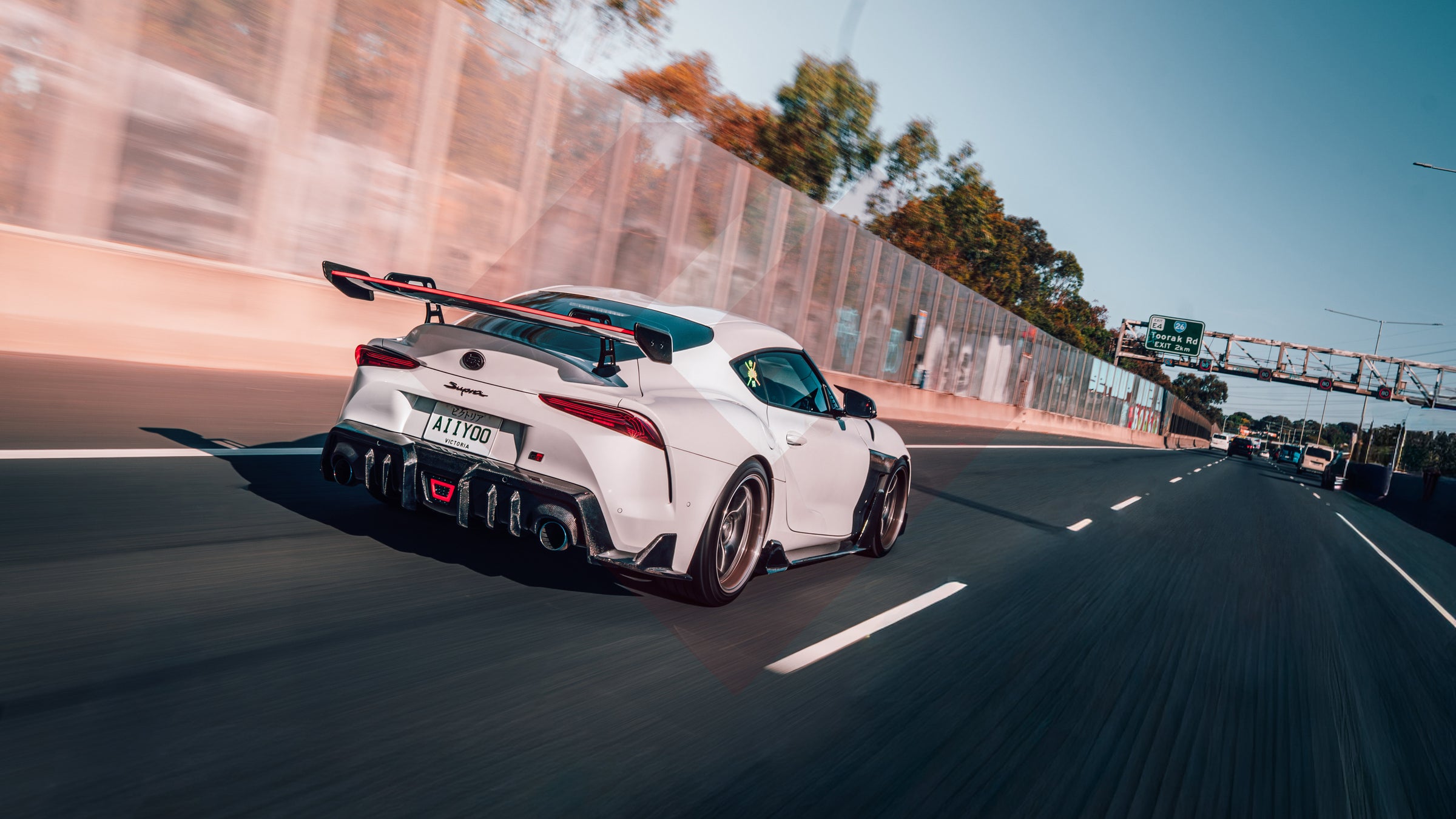 White sports car on a race track with blurred background
